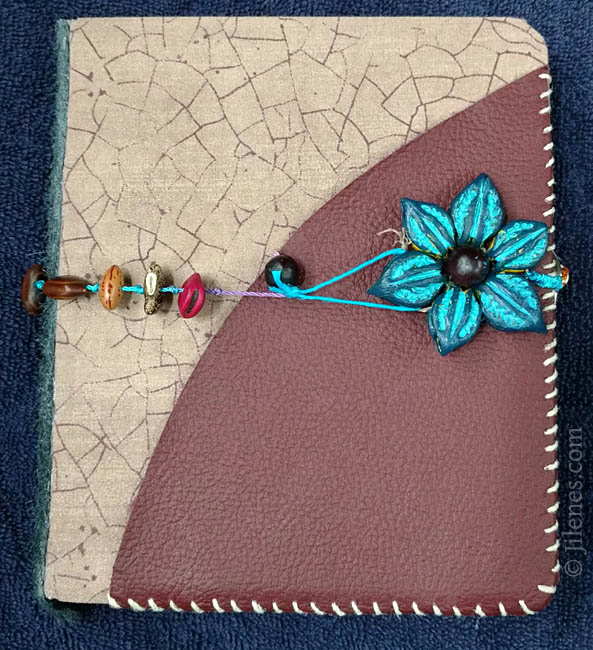 hand bound custom journal with seeds, flower and leather